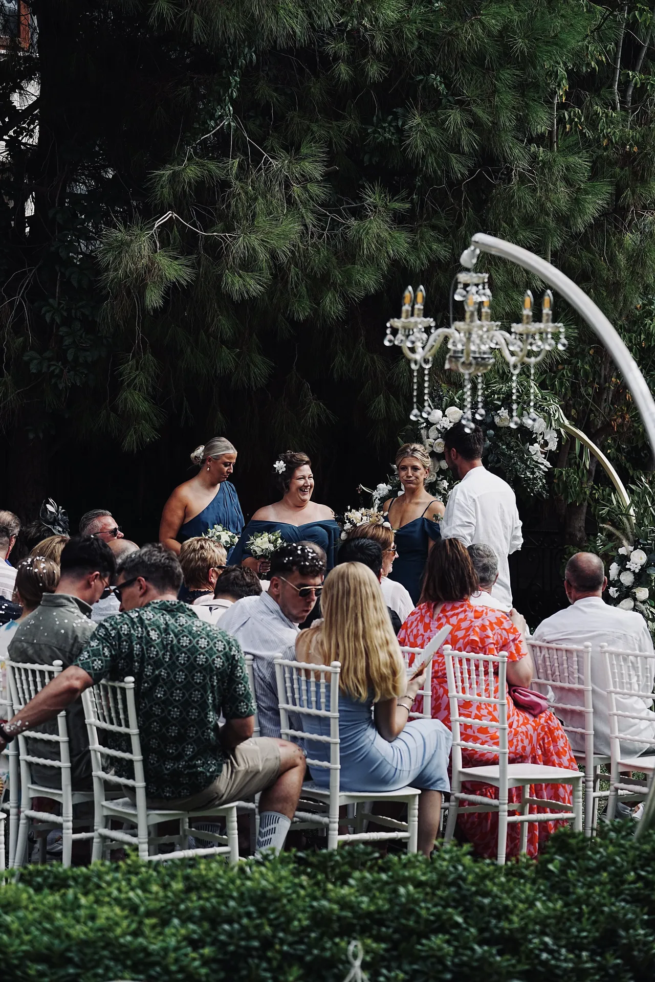Three bridesmaids in elegant navy blue dresses
