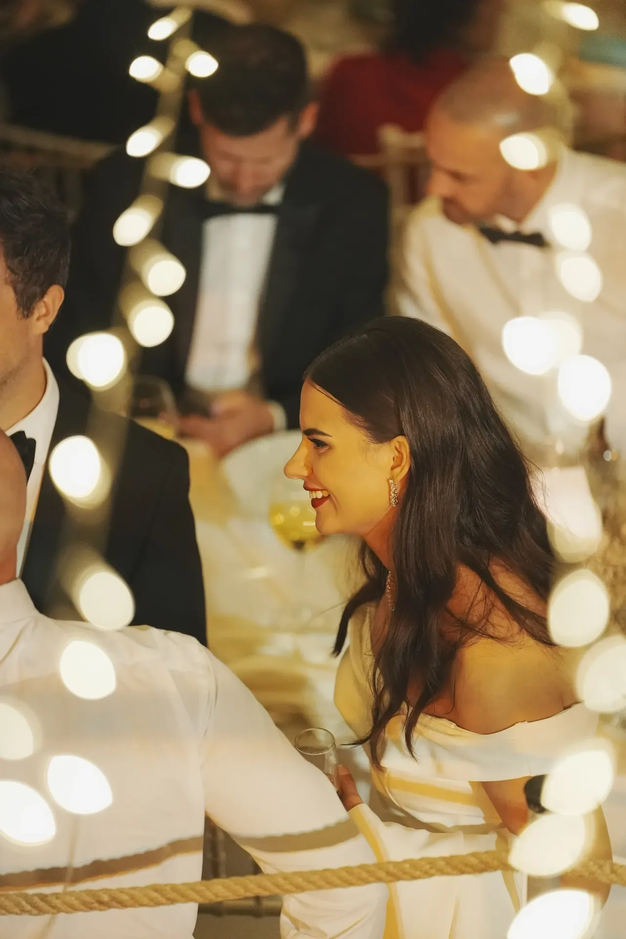 Couple on decorative swing with romantic bokeh lighting